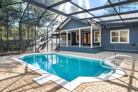 a view of a house with swimming pool