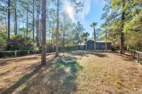 a house with trees in the background