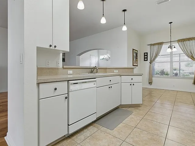 a bathroom with a tub and a sink