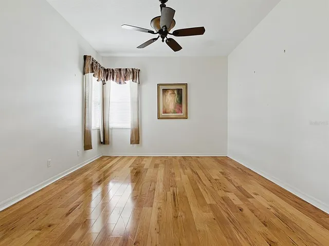 a front view of a house with a garden and plants