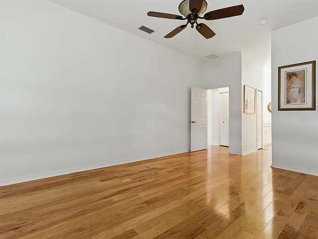 an aerial view of a house with garden space and street view