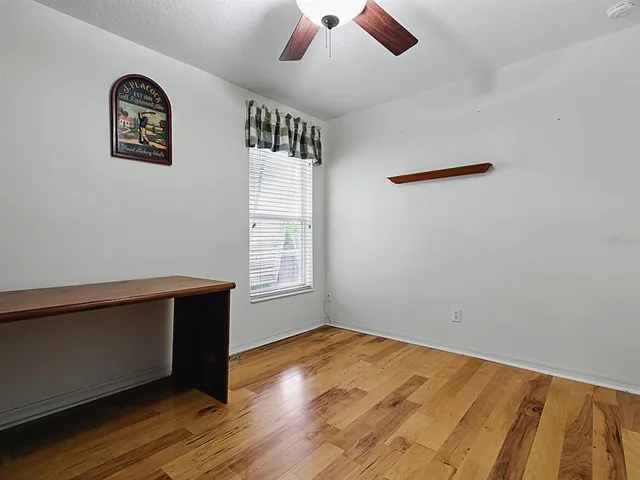 a room with gym equipment and a flat screen tv