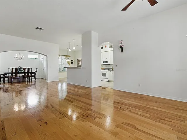 a view of a livingroom with furniture wooden floor fire place