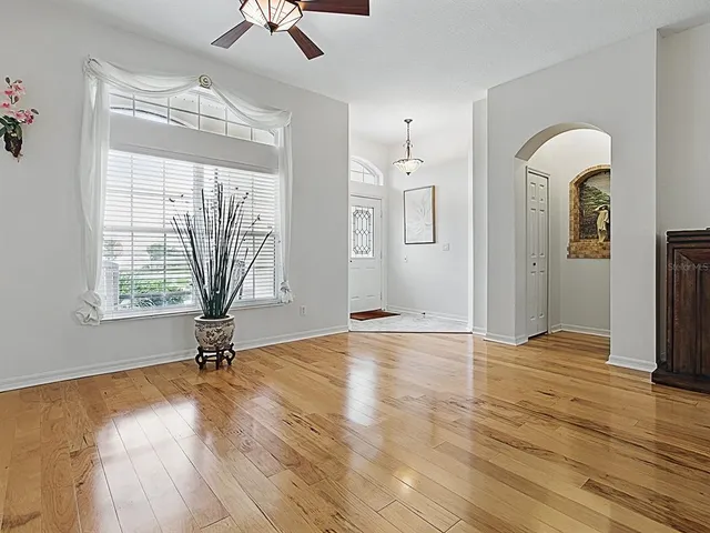 a view of a dining room with furniture and chandelier