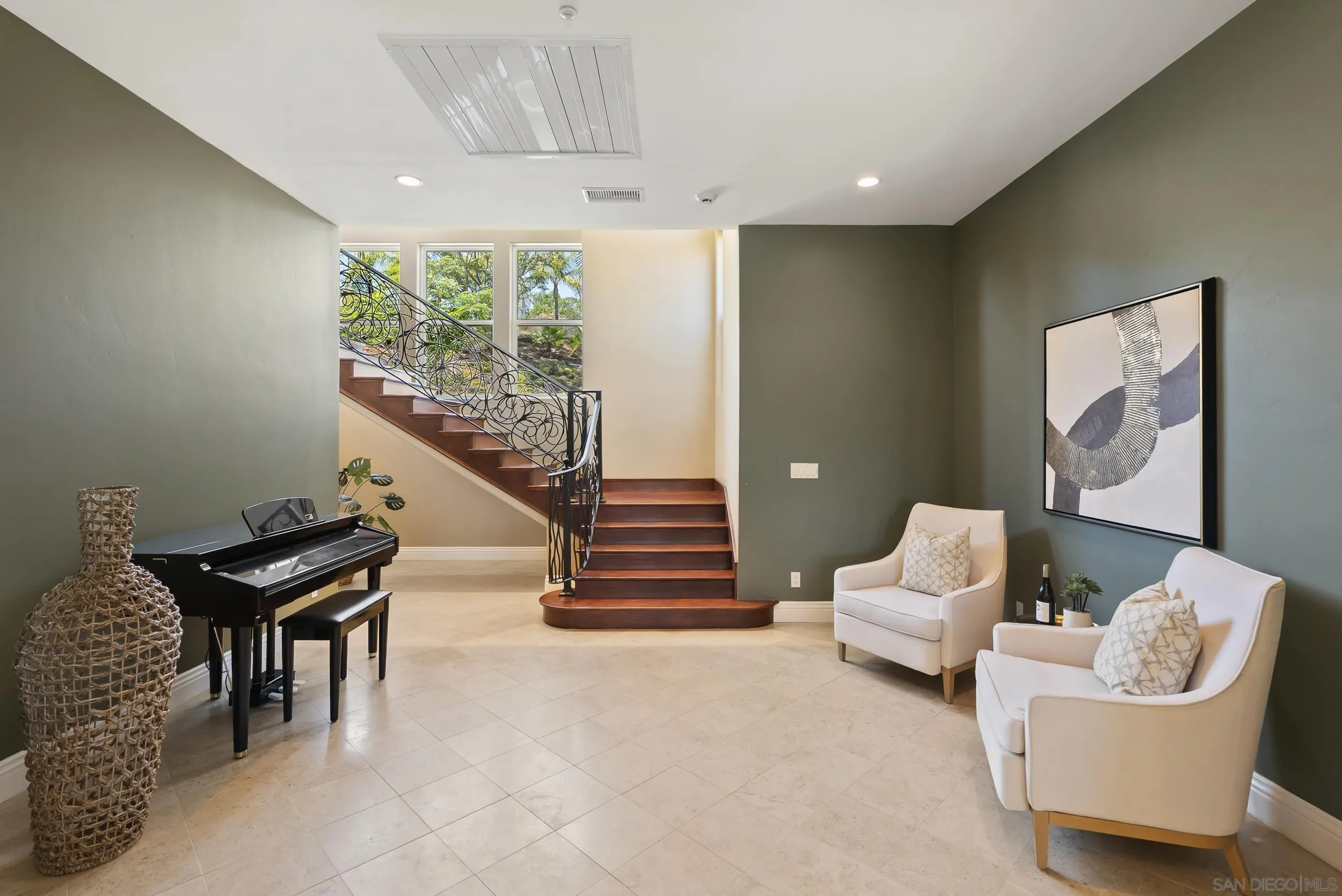 14998 Budwin Lane Poway, CA 92064 - Photo 29 of 44 a living room with furniture and a stairs