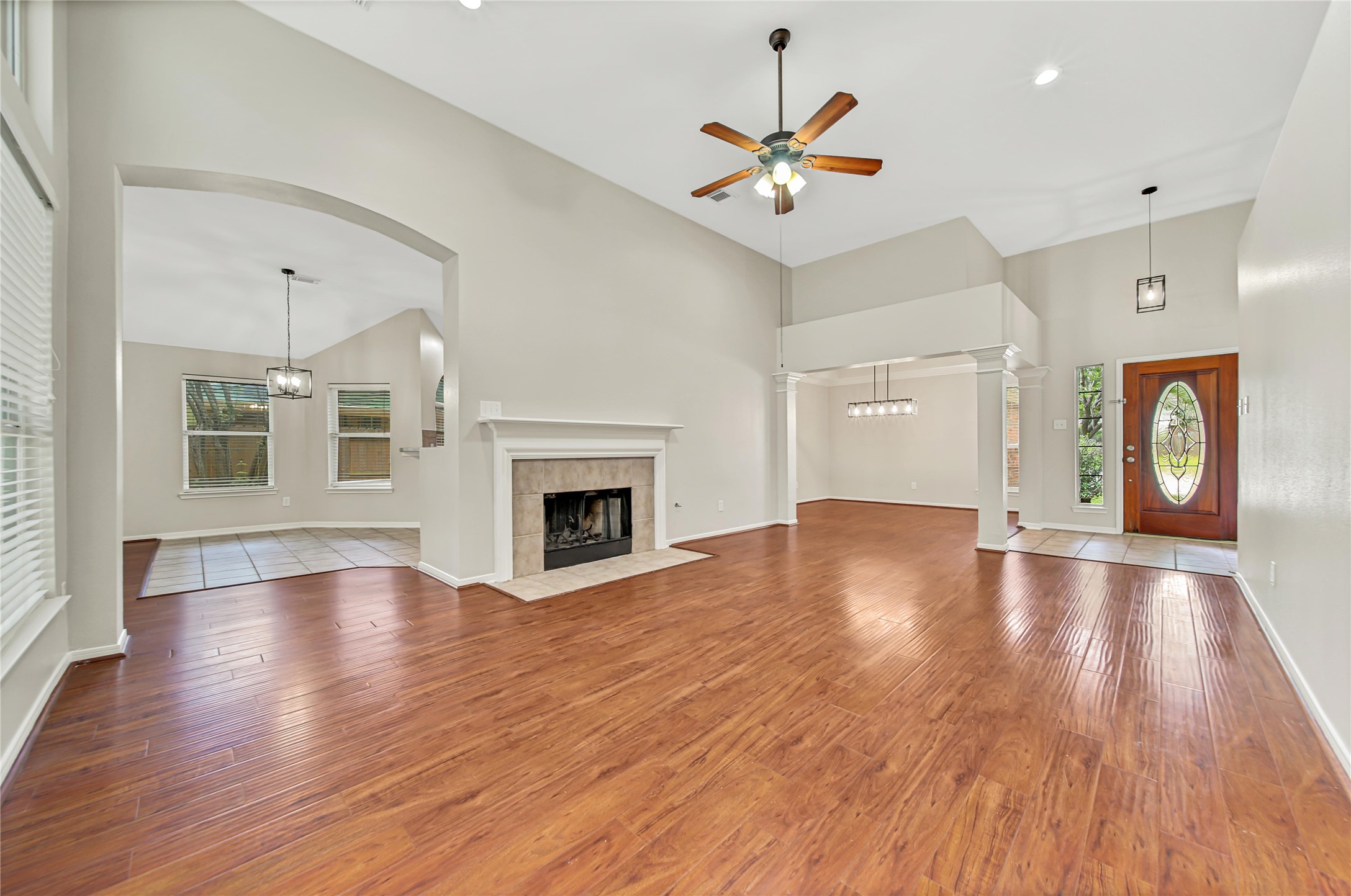 14526 Red Tailed Hawk Lane Houston, TX 77044 - Photo 7 of 40 a view of an empty room with wooden floor and fireplace