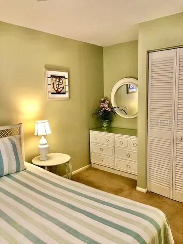 a bedroom with a bed and a dresser