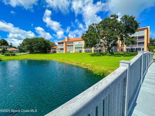 a view of a patio with table and chairs and potted plants