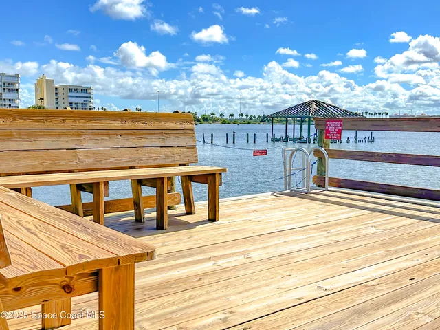 a view of a swimming pool with an outdoor seating