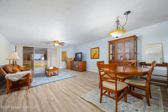 a dining room with a table and chairs