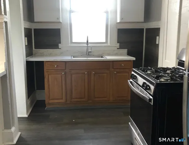a kitchen with a stove and a sink