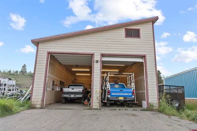 a view of a livingroom with furniture and a fireplace