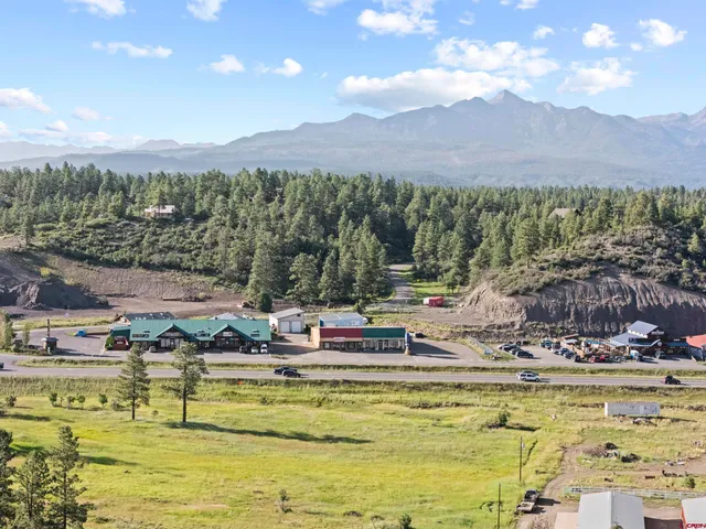 a living room with furniture and stairs