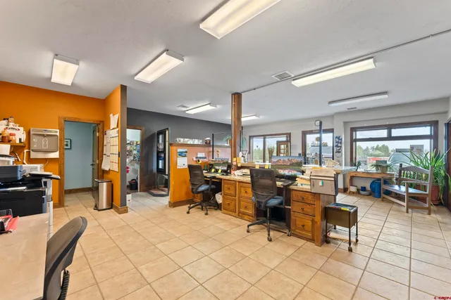 a kitchen that has a sink and a stove in it