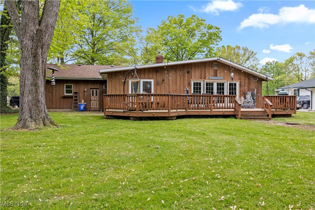 11811 Robson Road Grafton, OH 44044 - Photo 37 of 50 Rear view of property featuring a chimney, a deck, and a yard