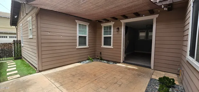 a view of house with backyard