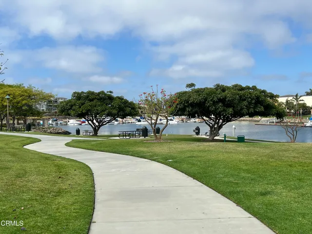a view of a park with houses