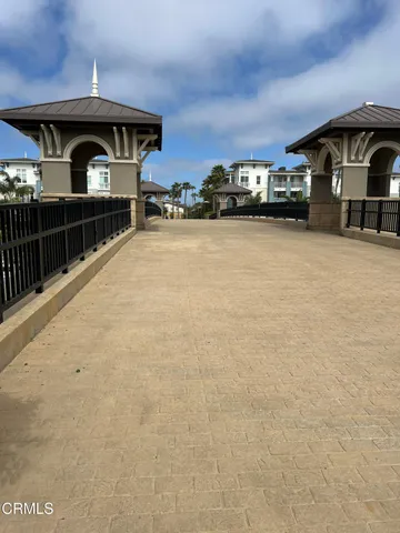 a view of building with car parked in front of it