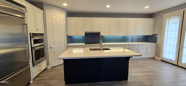 a bathroom with a sink a toilet and a shower