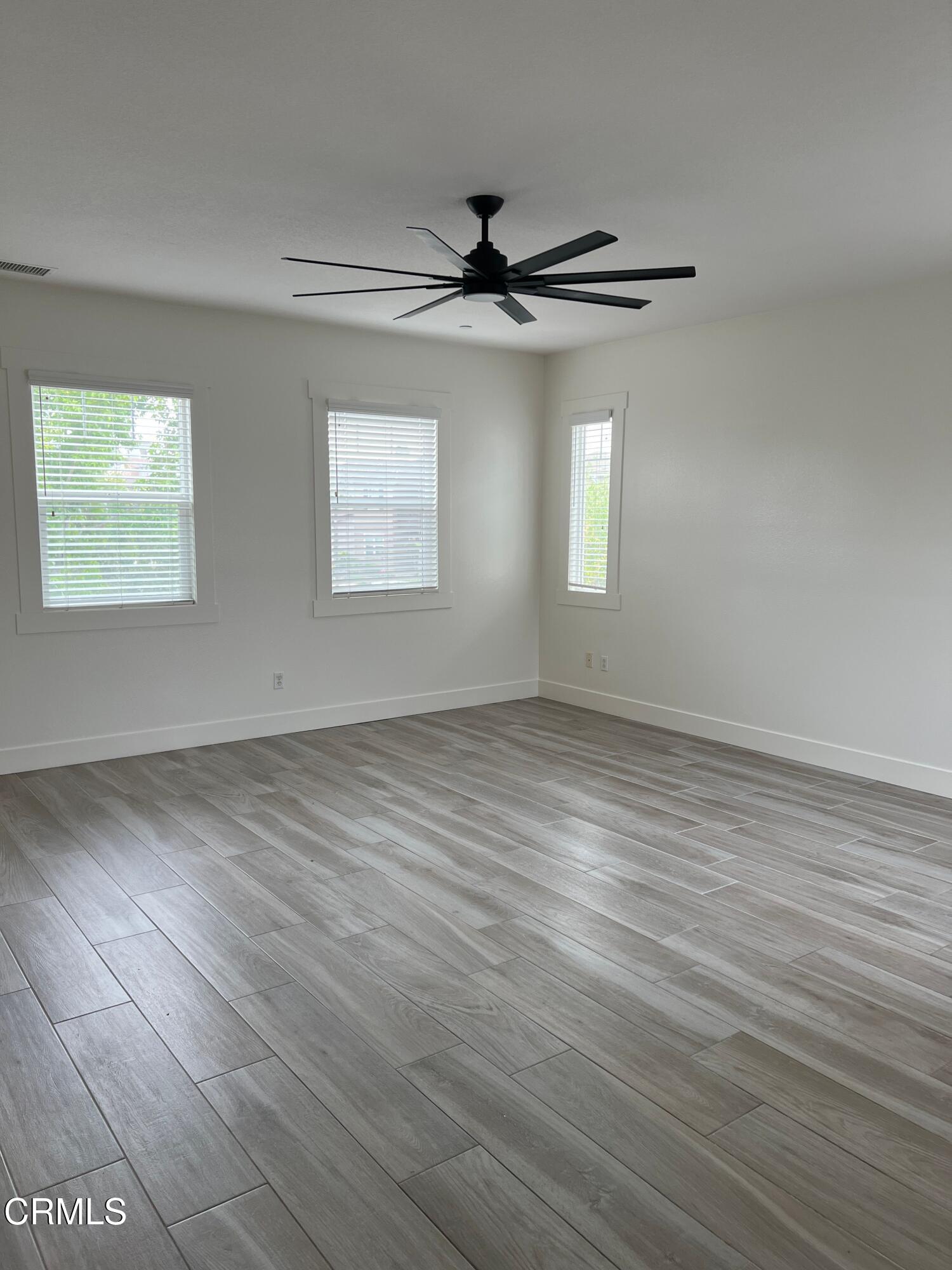1465 Donegal Way Oxnard, CA 93035 - Photo 6 of 20 wooden floor in an empty room with a window
