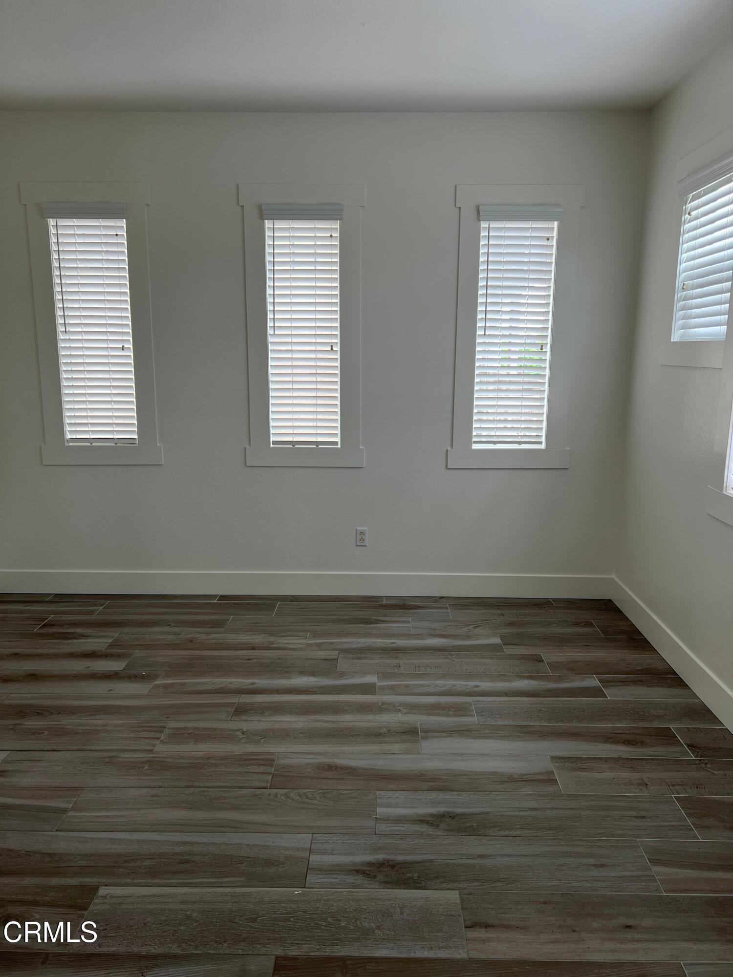 1465 Donegal Way Oxnard, CA 93035 - Photo 10 of 20 a view of a room with wooden floor and window