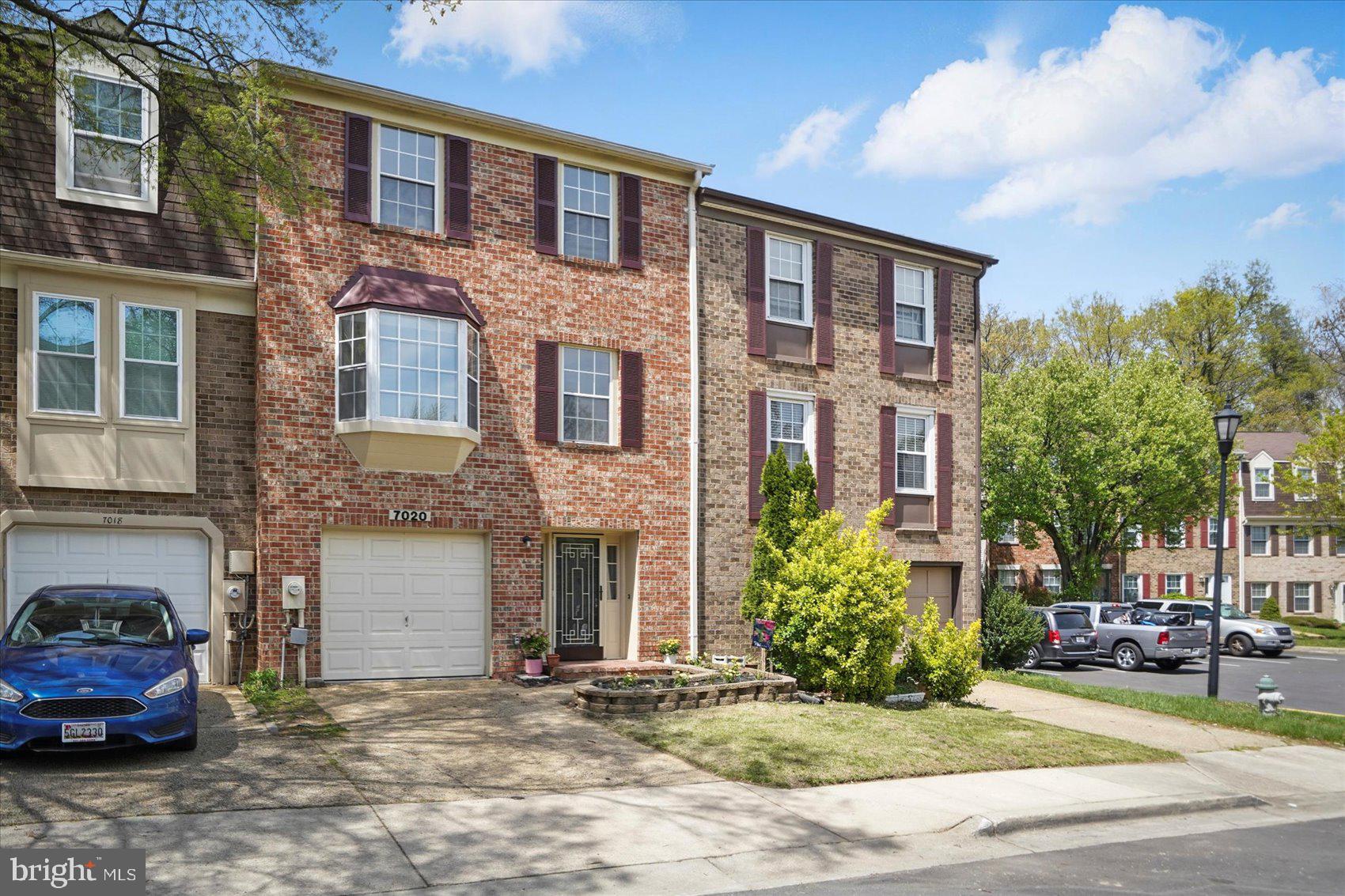 7020 Storch Lane Lanham, MD 20706 - Photo 1 of 44 a front view of a house with a yard