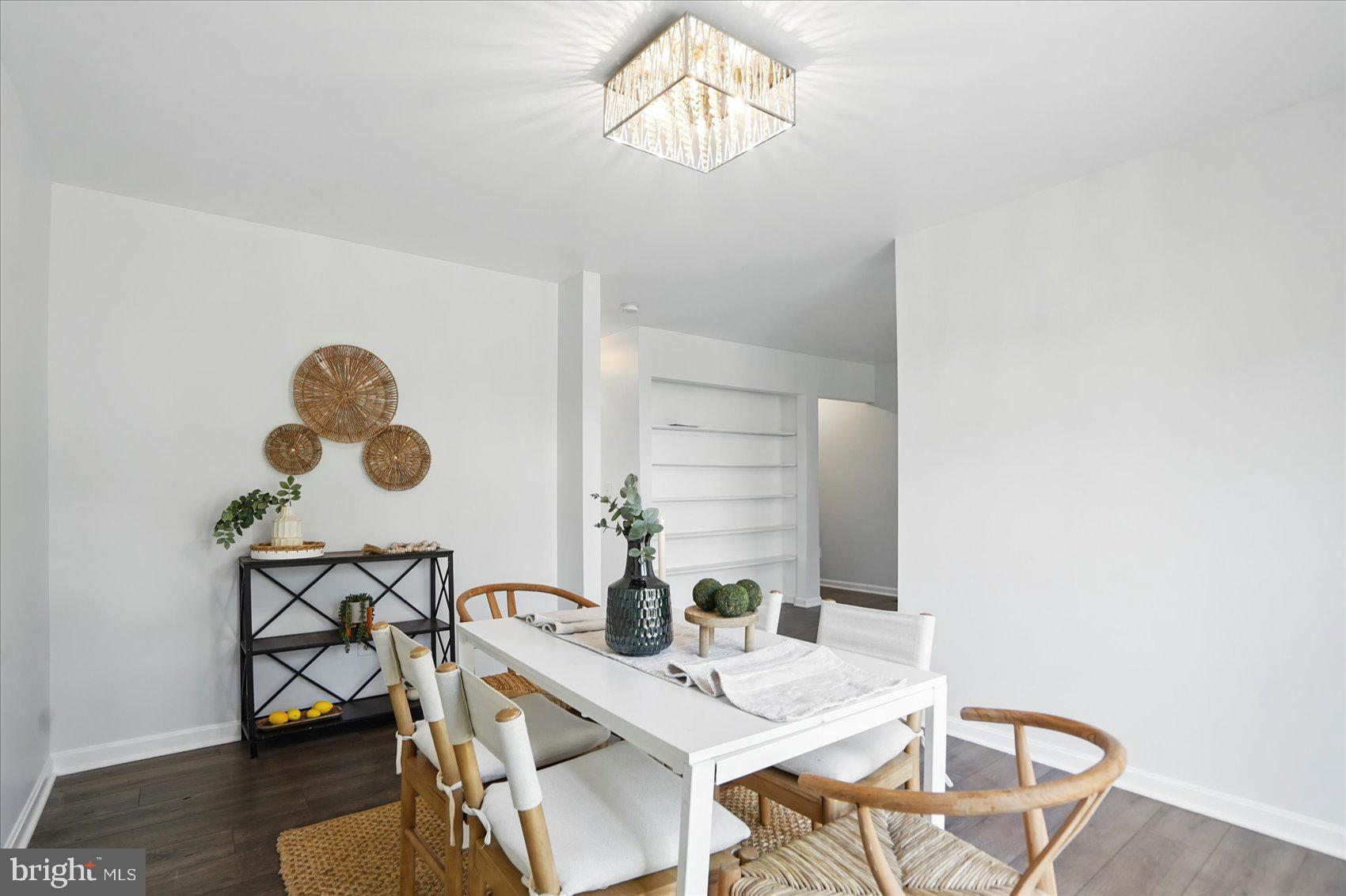 7020 Storch Lane Lanham, MD 20706 - Photo 15 of 44 a view of a dining room with furniture and wooden floor