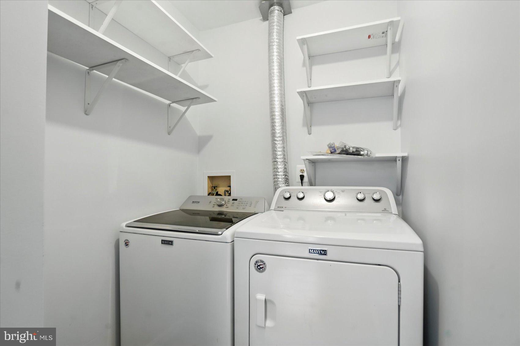 7020 Storch Lane Lanham, MD 20706 - Photo 16 of 44 a utility room with dryer and washer