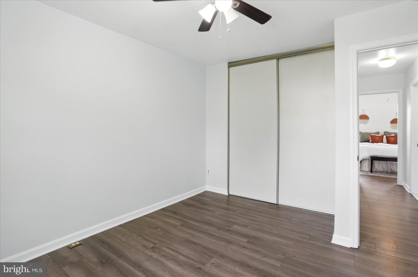 7020 Storch Lane Lanham, MD 20706 - Photo 33 of 44 a view of empty room with wooden floor