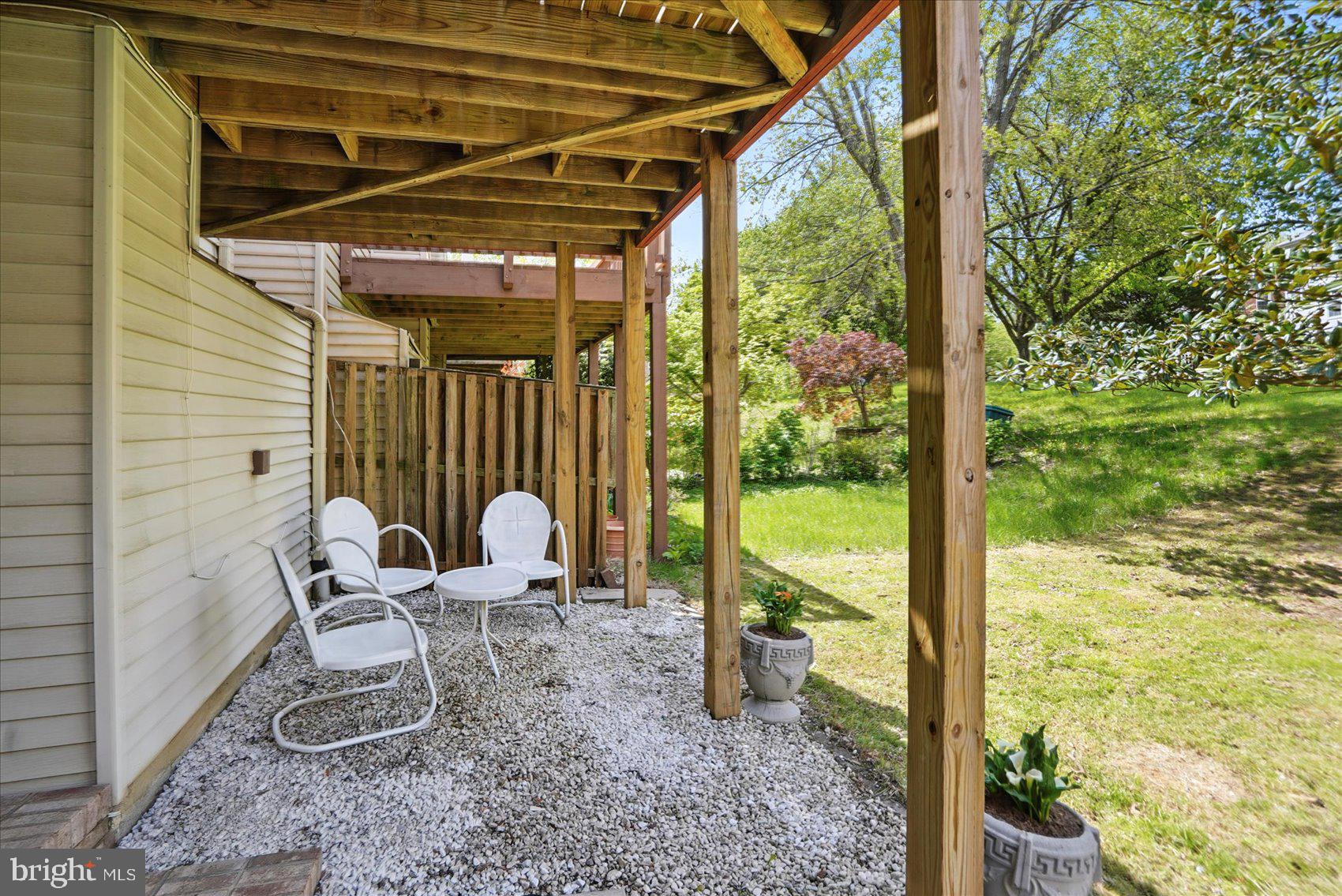 7020 Storch Lane Lanham, MD 20706 - Photo 36 of 44 a view of a chair in the patio with a backyard