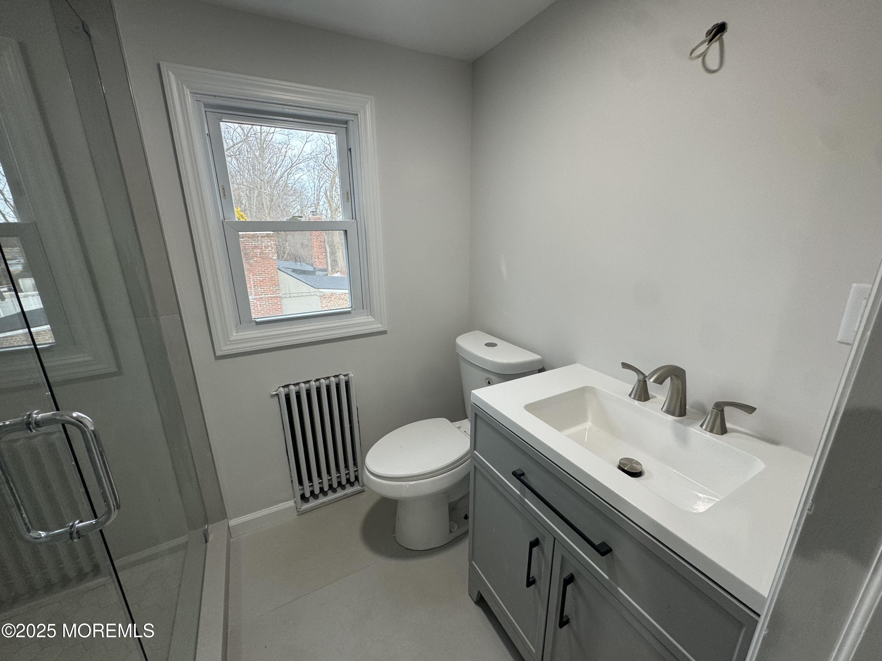 259 Matawan Avenue Matawan, NJ 07747 - Photo 17 of 46 a bathroom with a sink toilet and a mirror