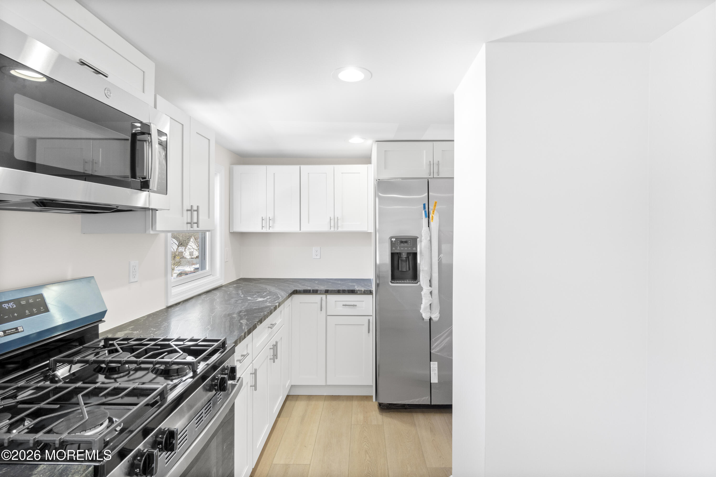 259 Matawan Avenue Matawan, NJ 07747 - Photo 25 of 46 a kitchen with a stove and a microwave