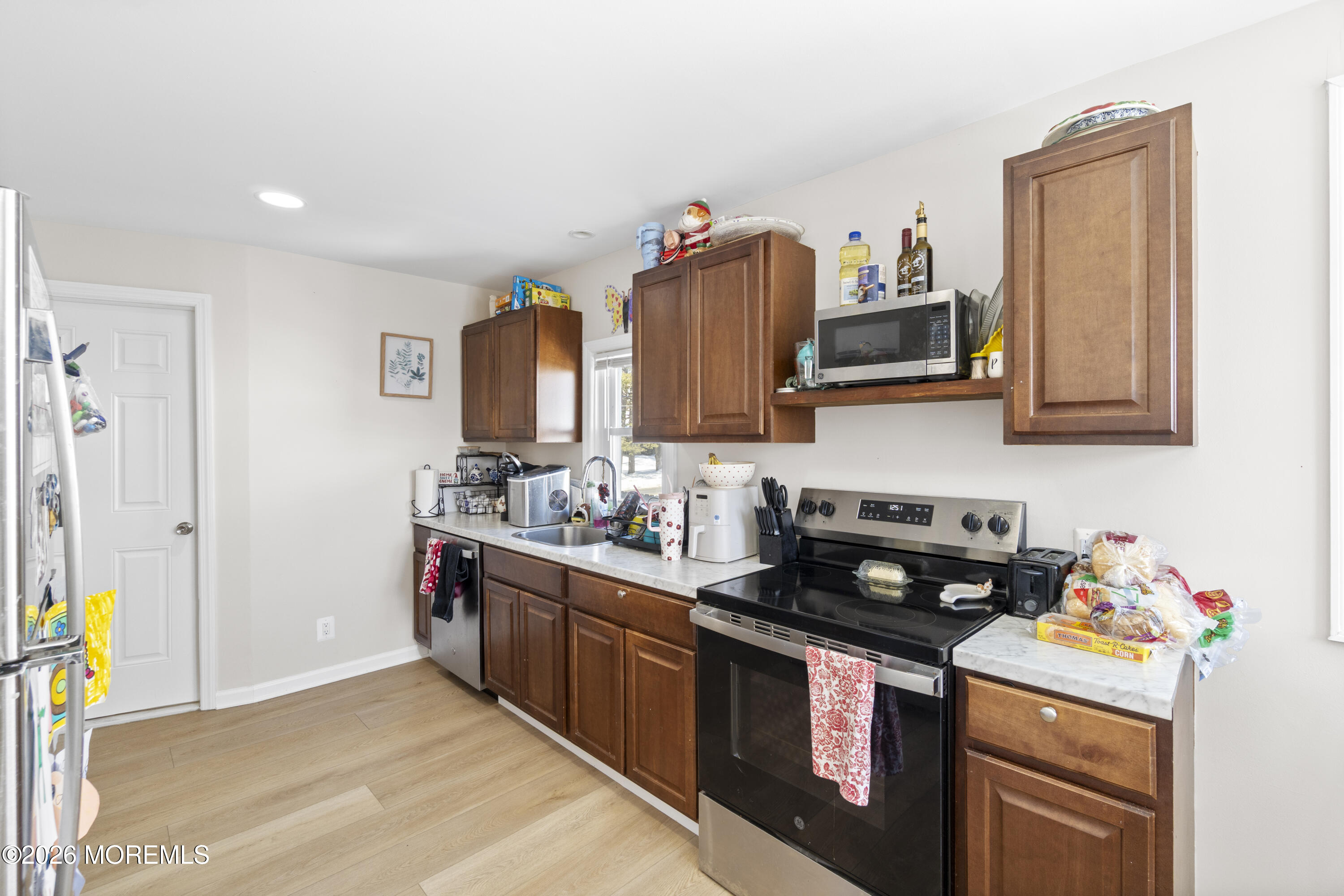 259 Matawan Avenue Matawan, NJ 07747 - Photo 28 of 46 a kitchen with stainless steel appliances granite countertop a stove a sink and a microwave