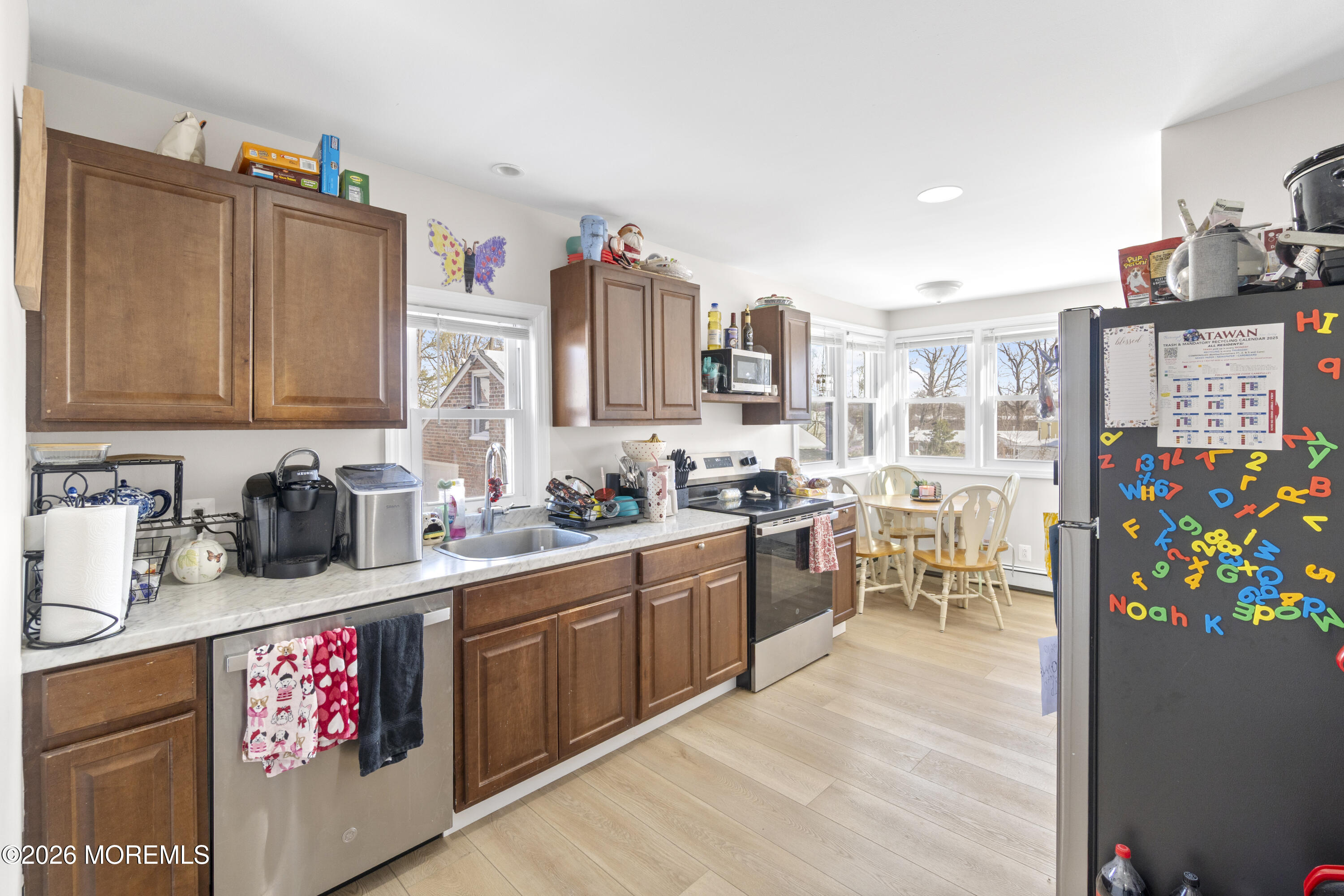 259 Matawan Avenue Matawan, NJ 07747 - Photo 29 of 46 a kitchen filled with stainless steel appliances a sink and cabinets