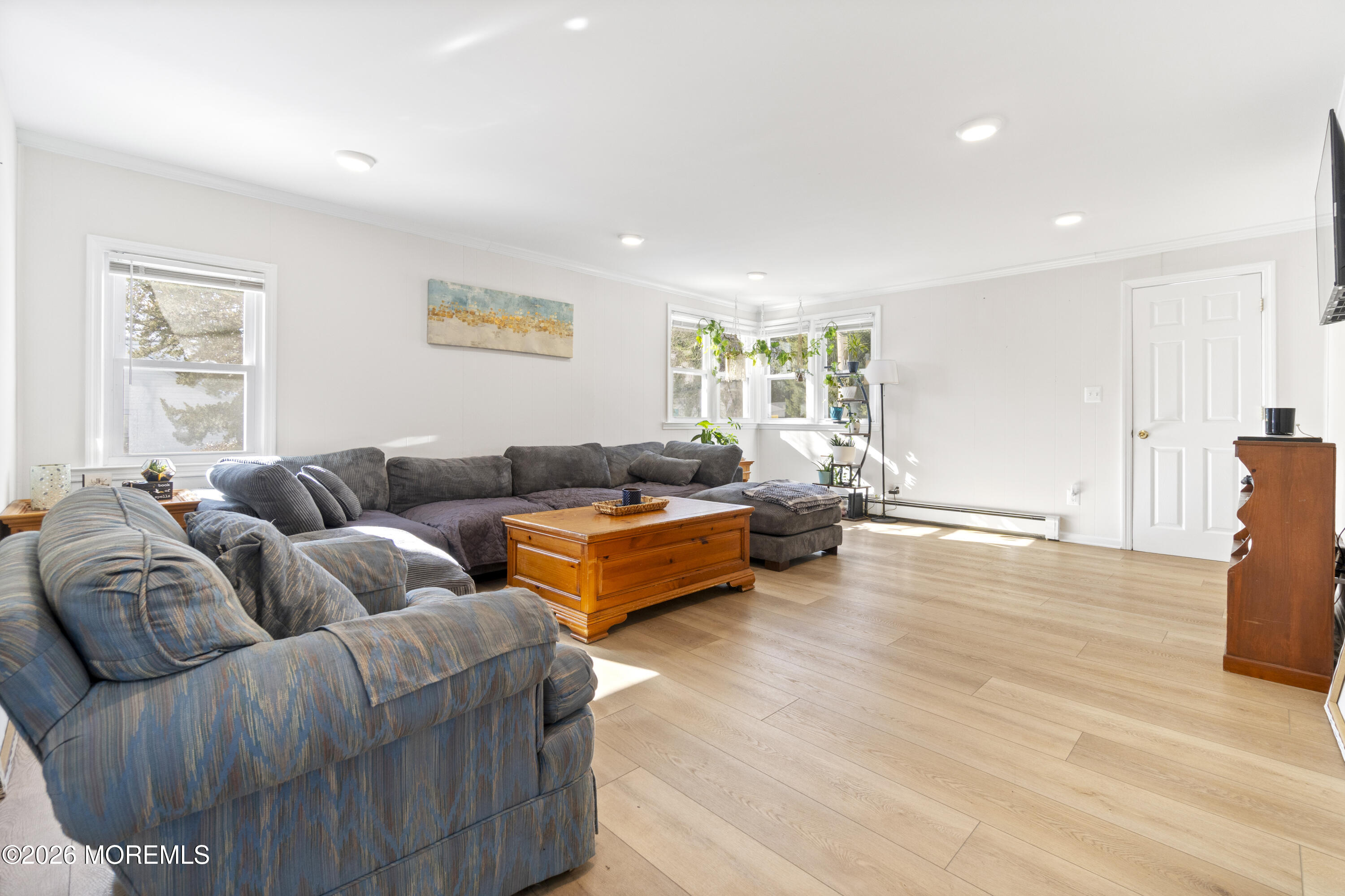 259 Matawan Avenue Matawan, NJ 07747 - Photo 32 of 46 a living room with furniture and a wooden floor