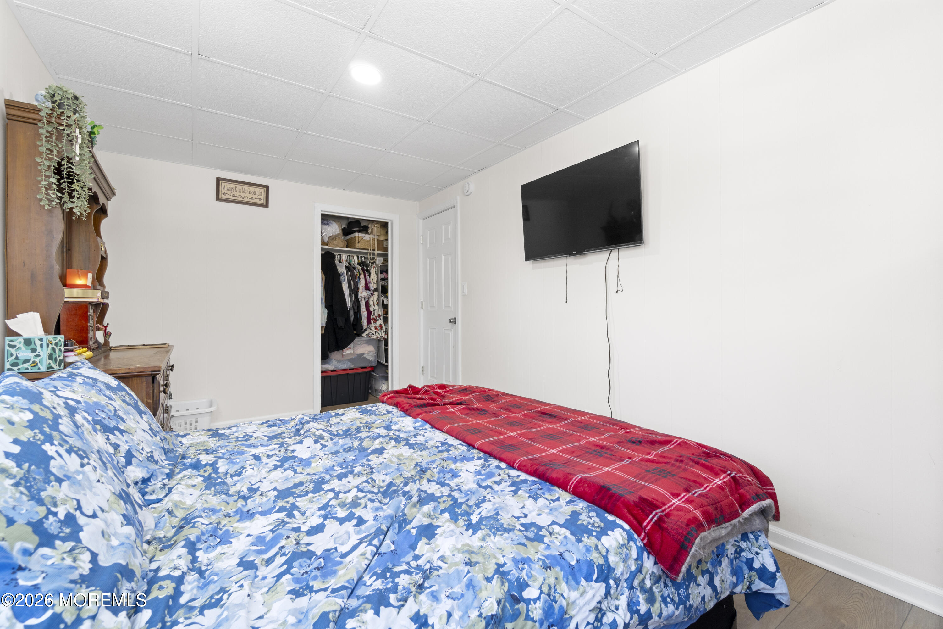 259 Matawan Avenue Matawan, NJ 07747 - Photo 36 of 46 a bedroom with a bed and a flat screen tv