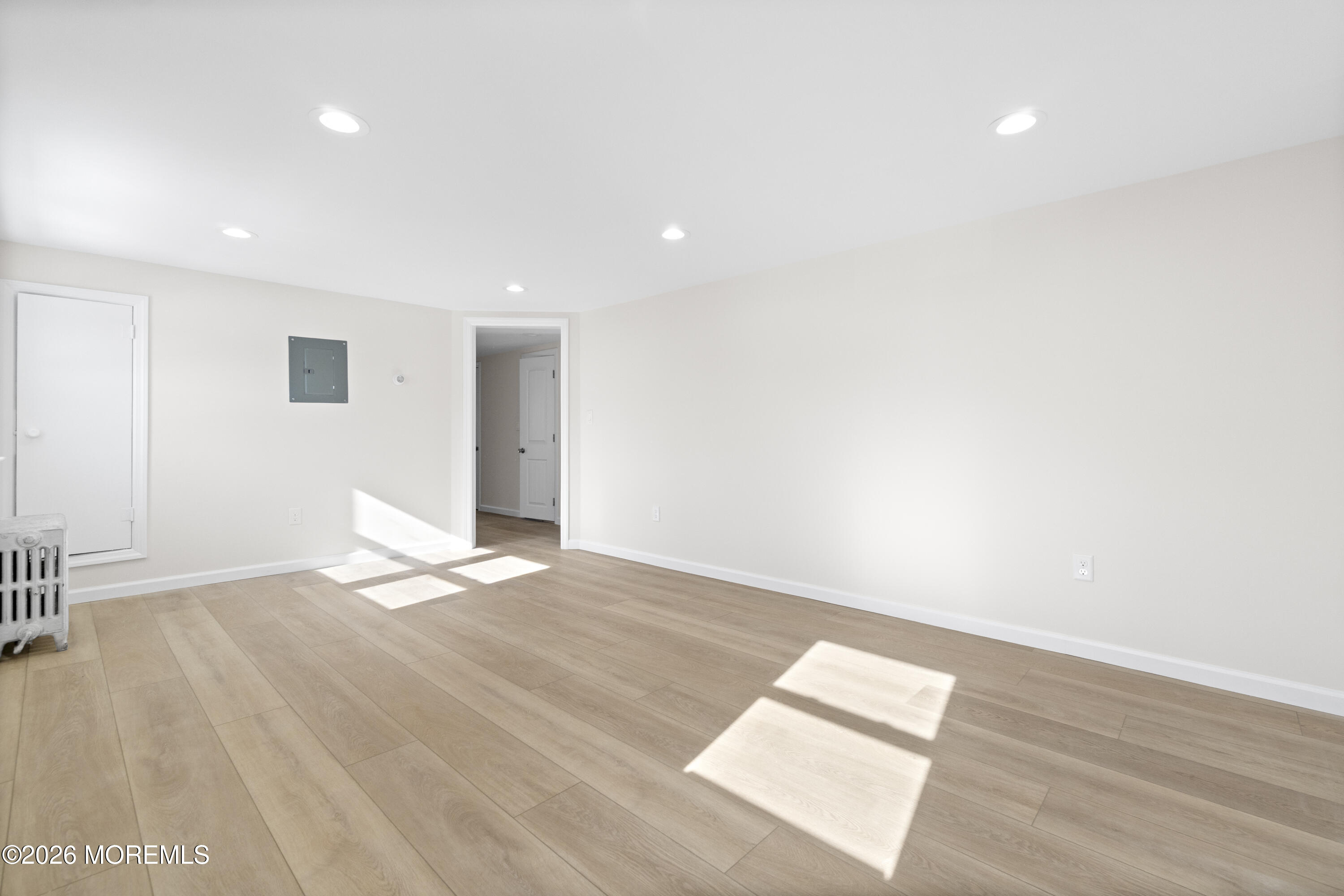 259 Matawan Avenue Matawan, NJ 07747 - Photo 39 of 46 a view of an empty room with wooden floor and a window