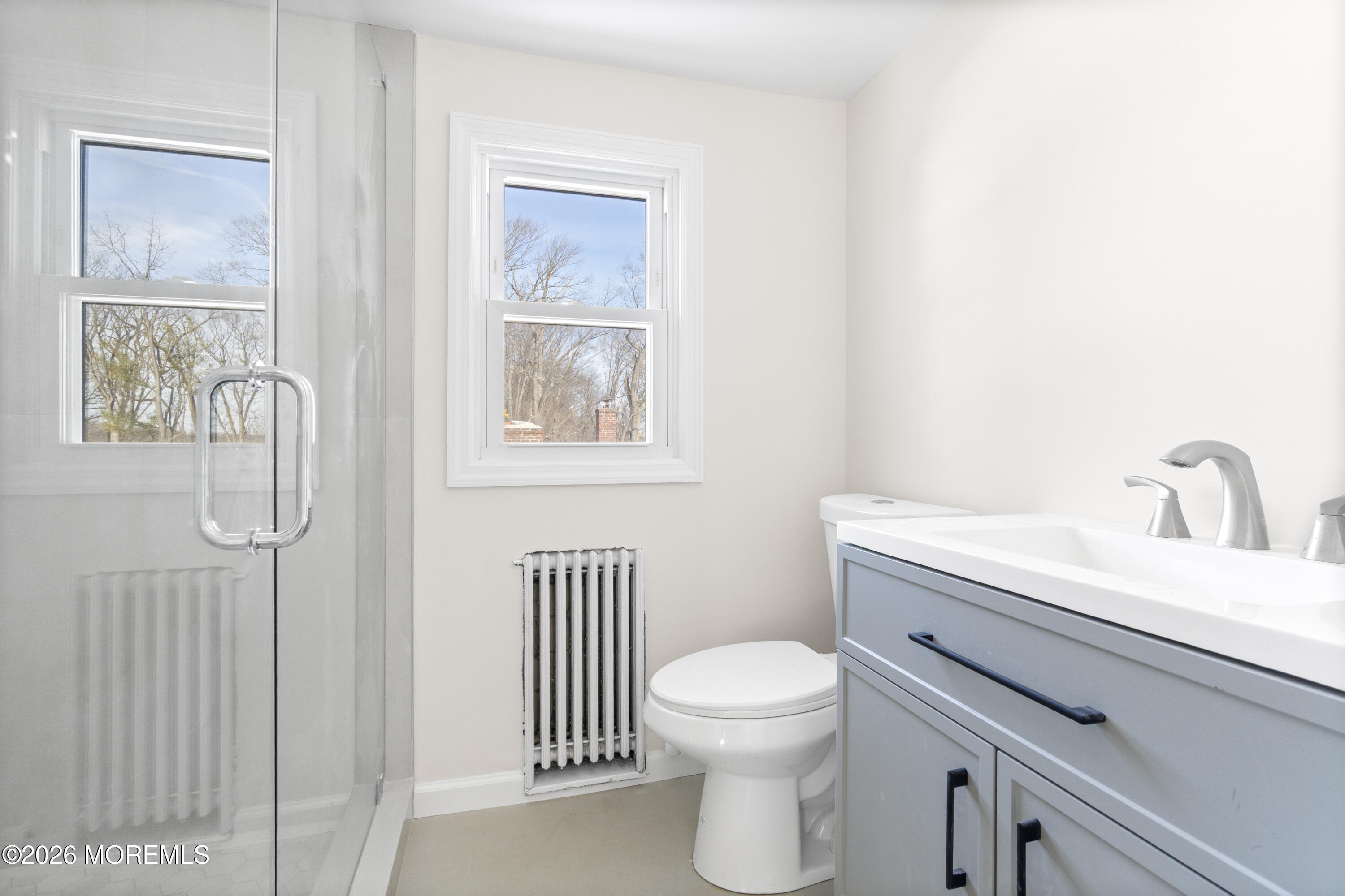 259 Matawan Avenue Matawan, NJ 07747 - Photo 8 of 46 a bathroom with a toilet a sink and a window