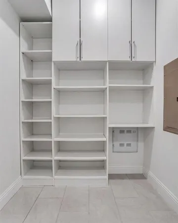 a view of an empty walk in closet
