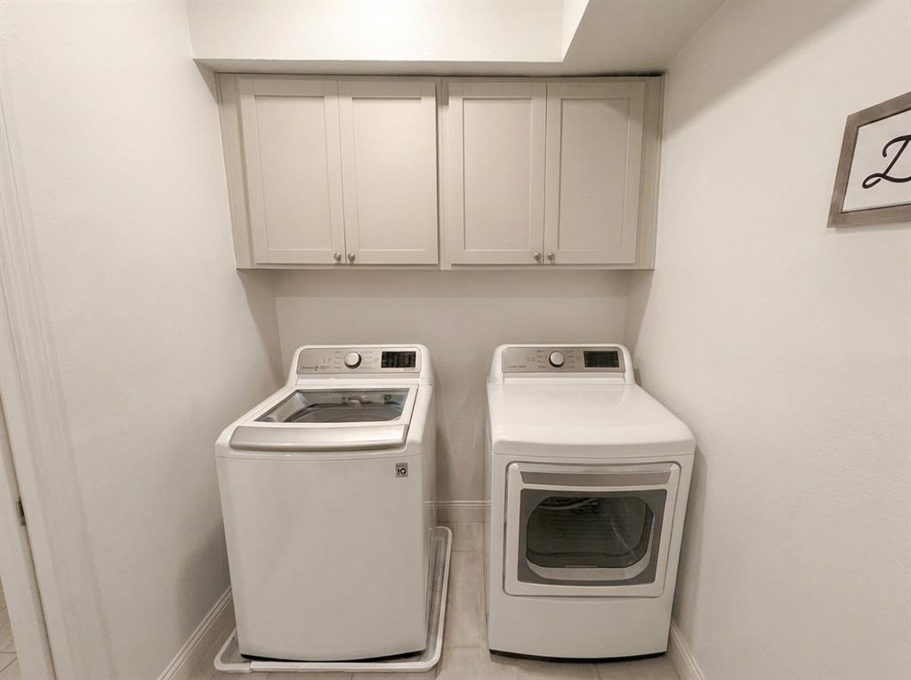 651 Watters Road, Unit 1206 Allen, TX 75013 - Photo 12 of 29 a utility room with dryer and washer