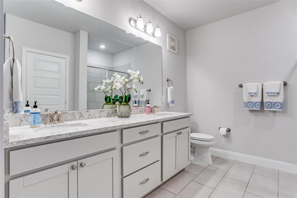 651 Watters Road, Unit 1206 Allen, TX 75013 - Photo 15 of 29 a bathroom with a granite countertop sink mirror and toilet