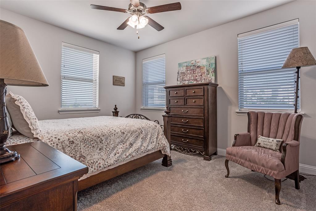 651 Watters Road, Unit 1206 Allen, TX 75013 - Photo 17 of 29 a bedroom with a bed and furniture