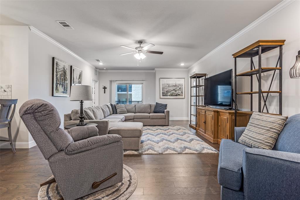 651 Watters Road, Unit 1206 Allen, TX 75013 - Photo 2 of 29 a living room with furniture fireplace and a large window