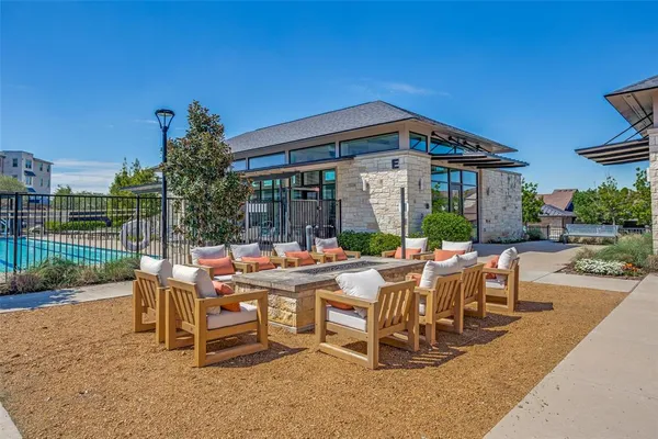 a view of a patio with a table and chairs