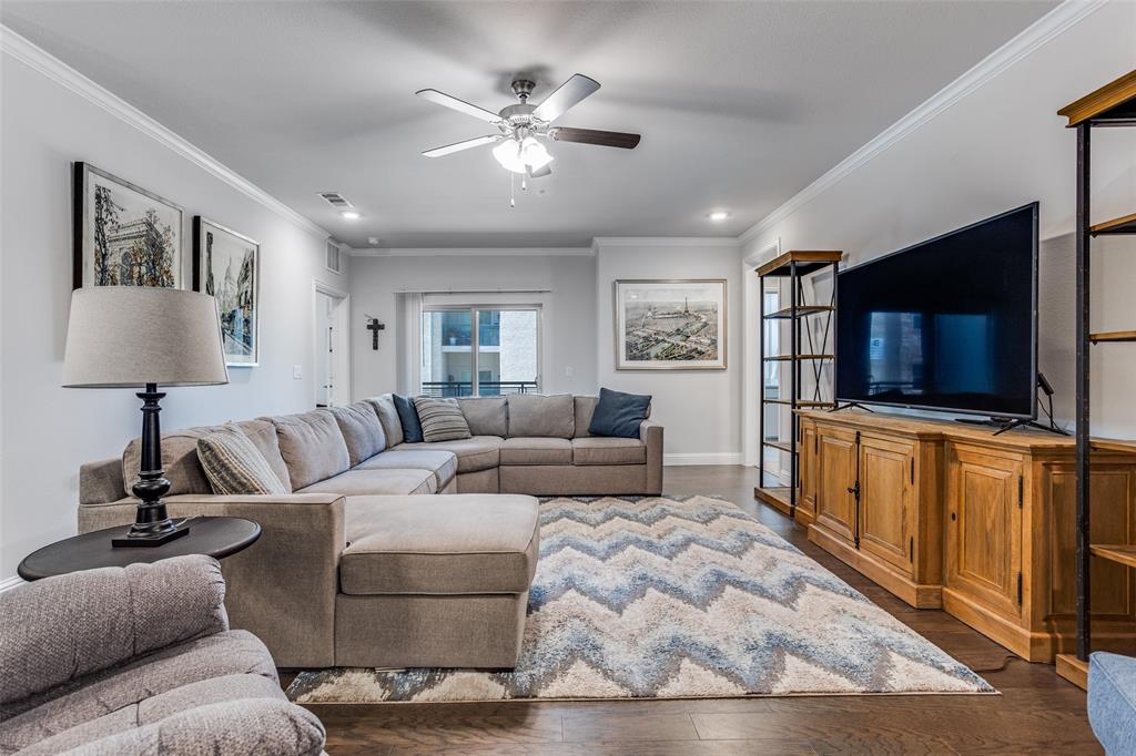 651 Watters Road, Unit 1206 Allen, TX 75013 - Photo 5 of 29 a living room with furniture and a flat screen tv