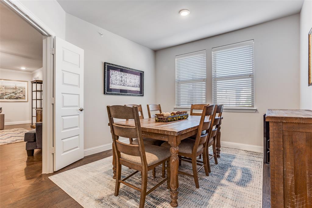 651 Watters Road, Unit 1206 Allen, TX 75013 - Photo 9 of 29 a view of a dining room with furniture and wooden floor
