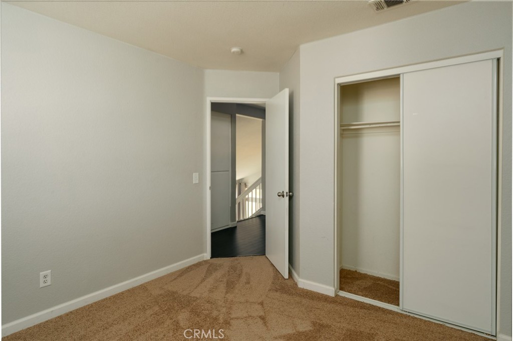 43425 Corte Logrono Temecula, CA 92592 - Photo 18 of 30 an empty room with closet and mirror