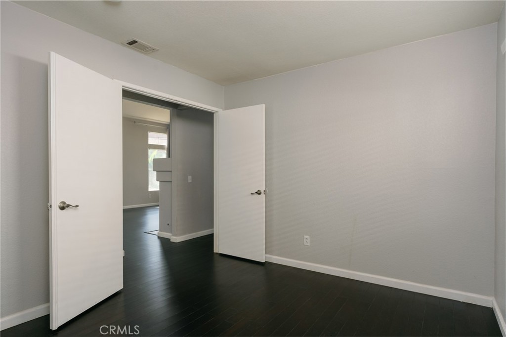 43425 Corte Logrono Temecula, CA 92592 - Photo 7 of 30 a view of a hallway with wooden floor
