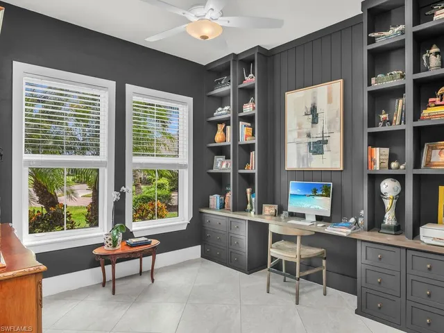 a work room with furniture and a window