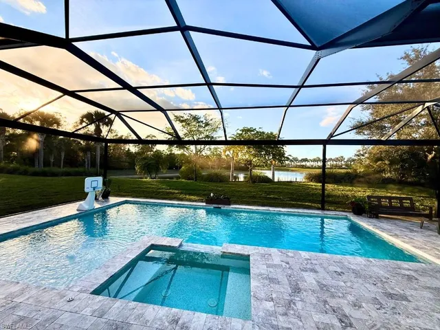 a view of a swimming pool with a patio